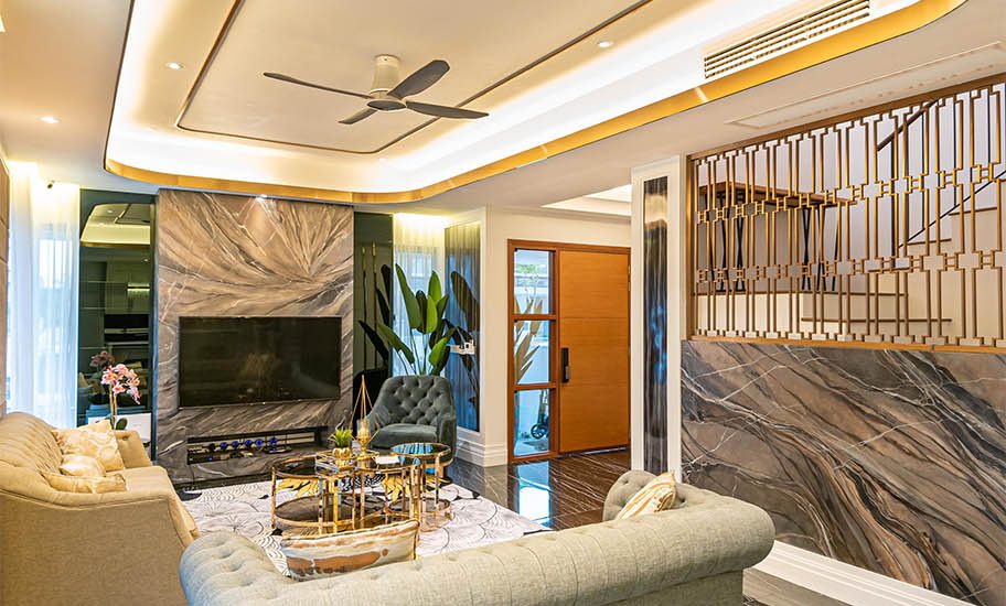 Luxurious Living Room With Velvet Wall Panes, Hidden Curtain Trail, Marble Tiles And Wall, Floral Carpet Design, Modern Classic Sofa, Orchid Flower Decoration, And Glass Coffee Table With Gold Frame, Earth Color Sofa, And Ceiling Air Conditioner