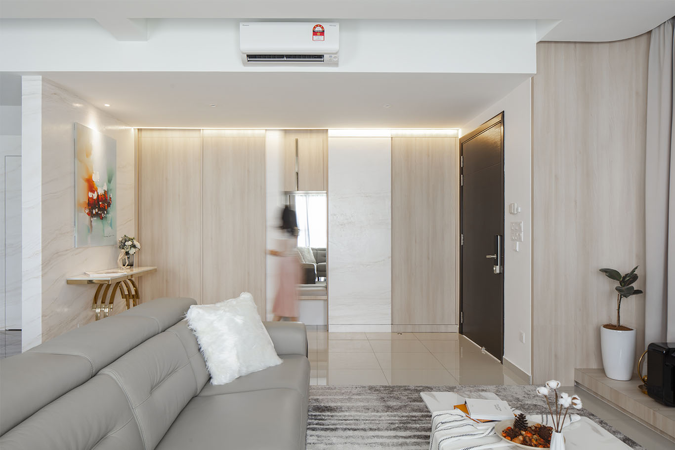 Grande Rhapsody minimalist living room with hidden spot Mieux interior design