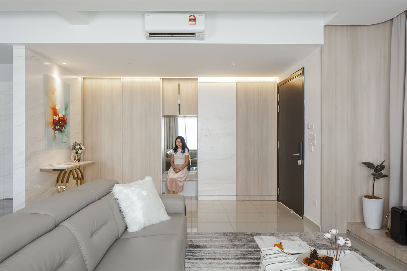 Grande Rhapsody minimalist living room with hidden sitting area Mieux interior design