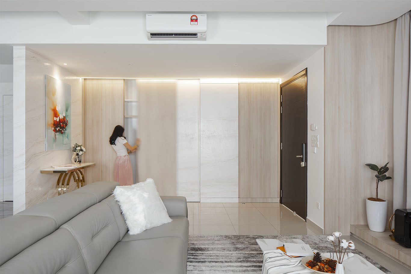 Grande Rhapsody minimalist living room with hidden wall cabinet Mieux interior design