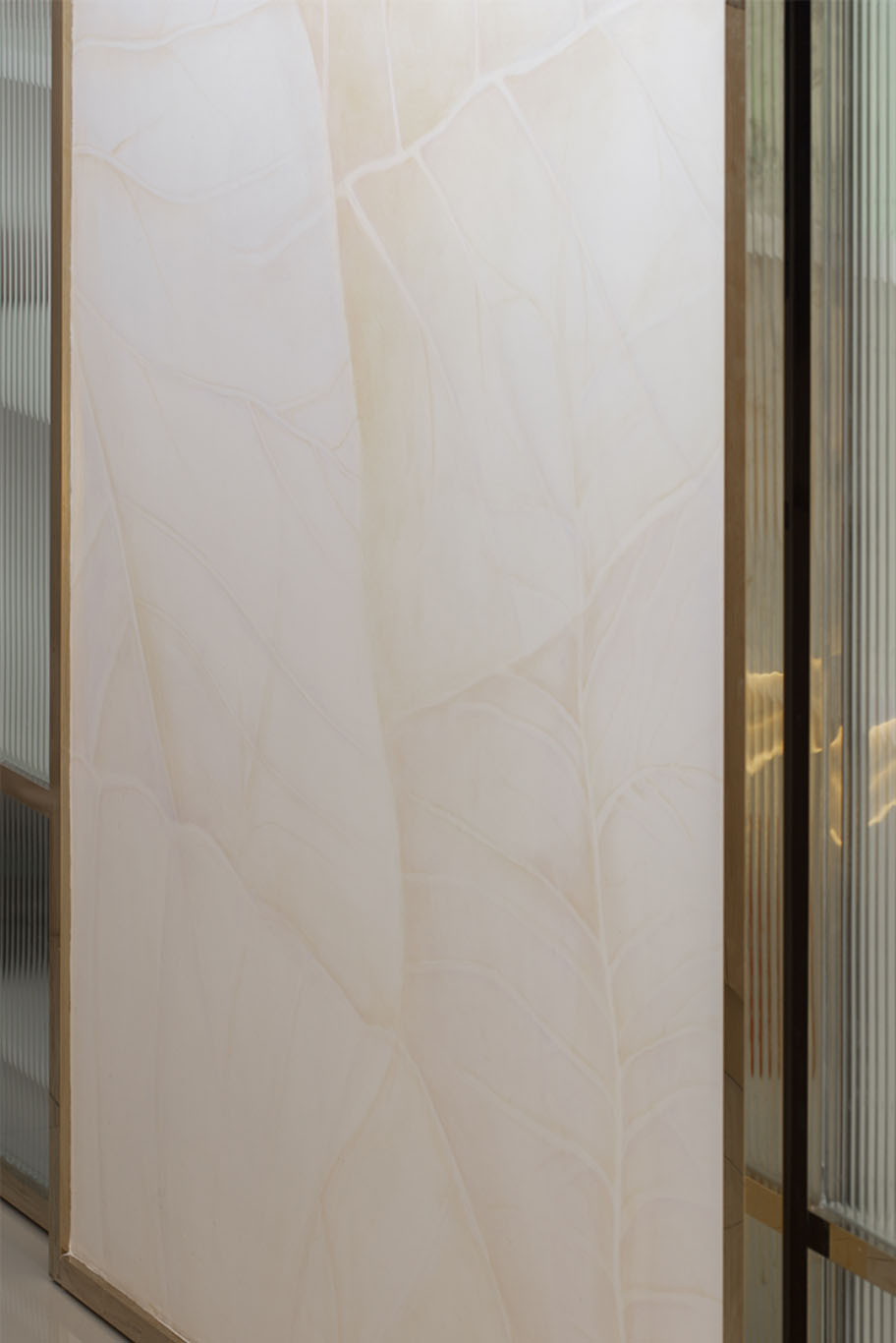 Grande Rhapsody white and gold marble wall Mieux interior design