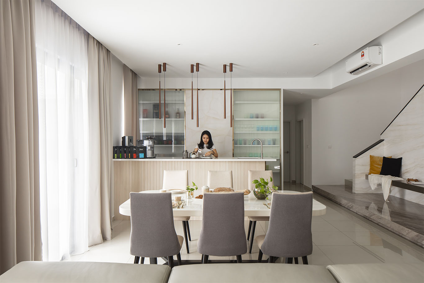 wide angle of dining room with kitchen