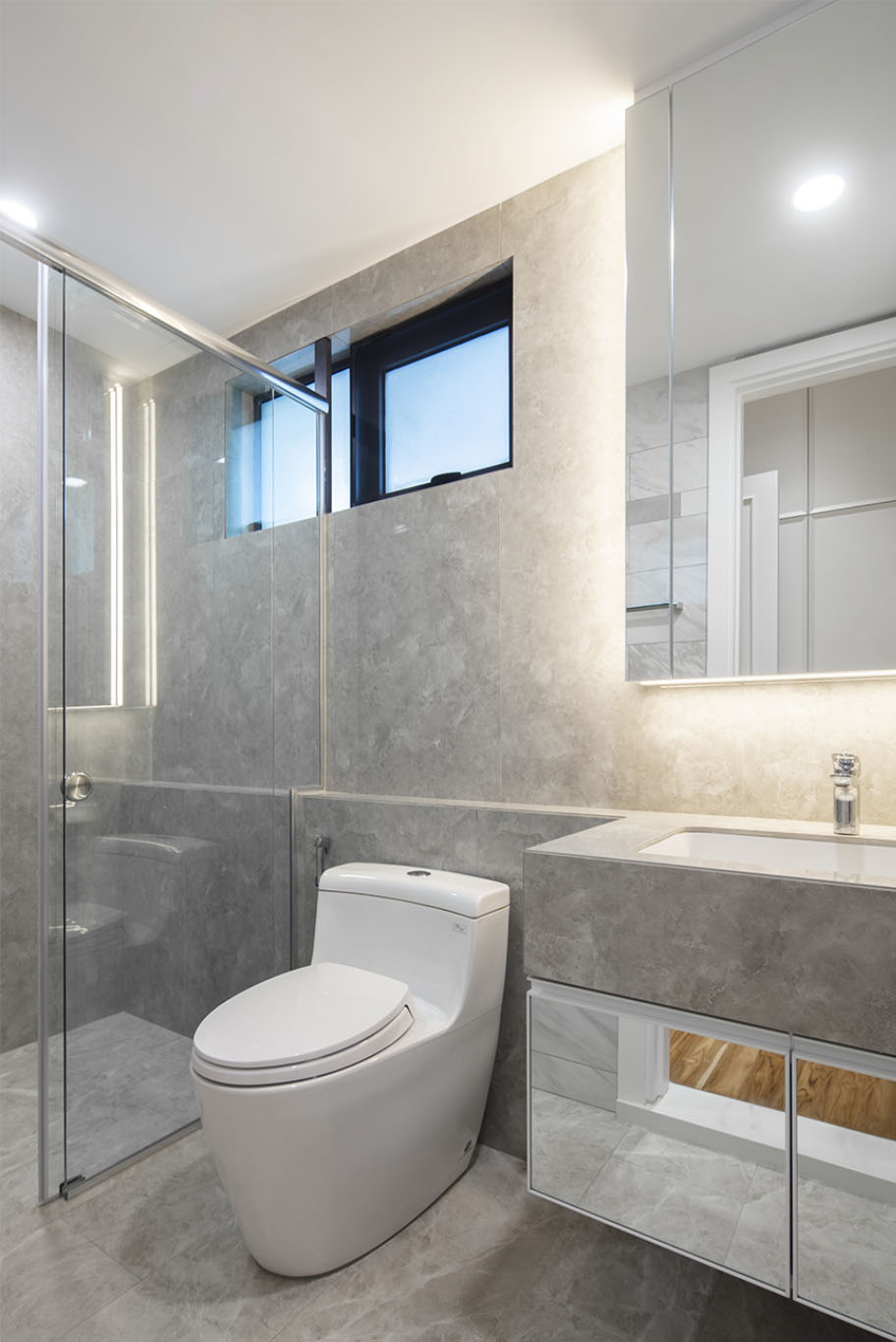 MIEUX The White Royale luxury toilet with grey marble wall and sink with frameless mirror mieux interior design