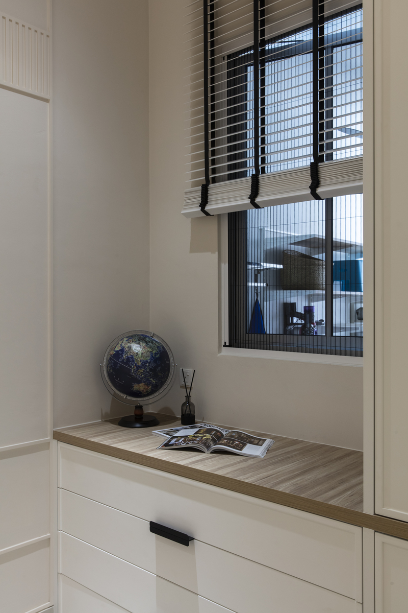 Bond of Aurora mini cabinet beside window with globe decoration Mieux interior design