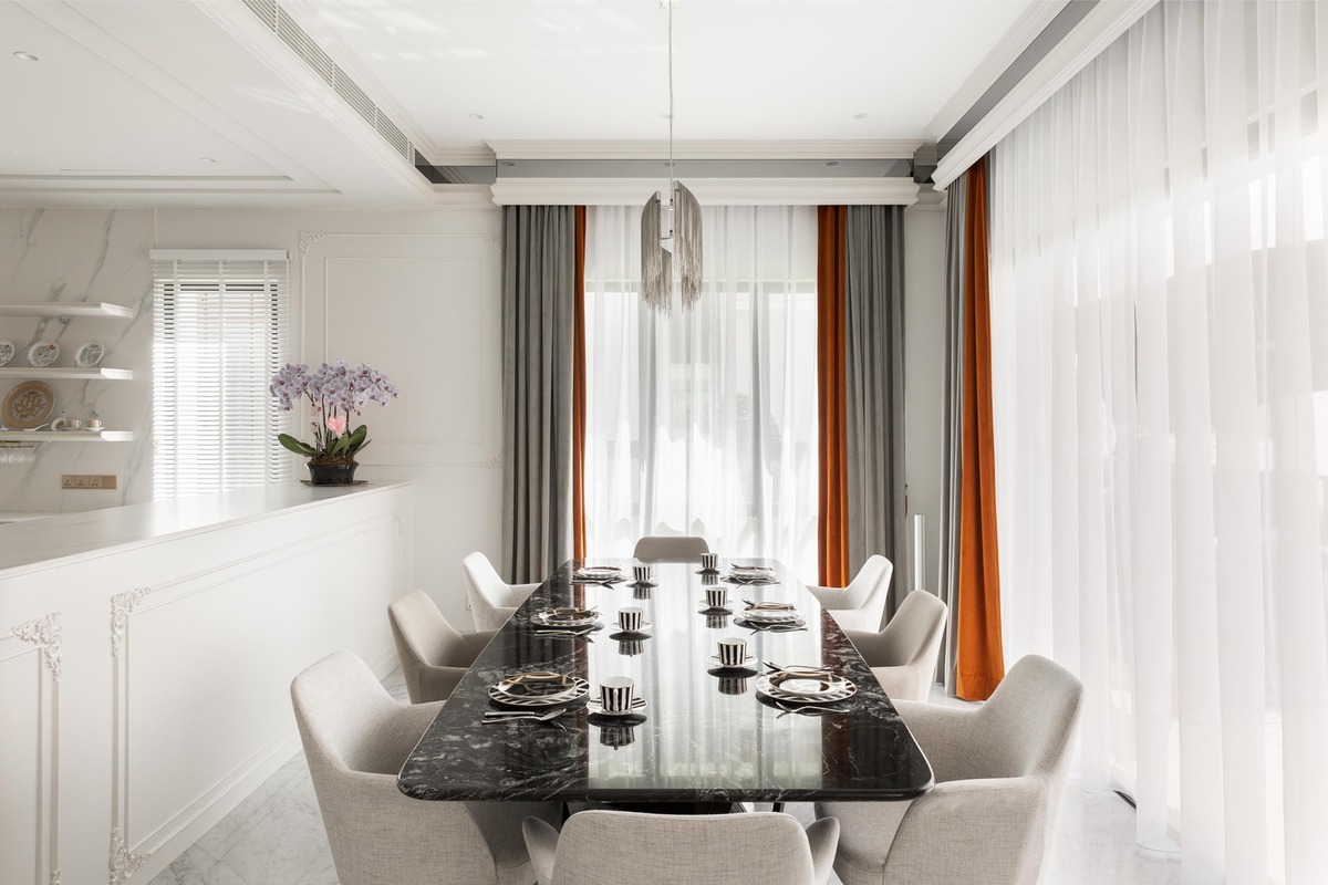 Luxurious dining area with marble dining table, mini chandelier