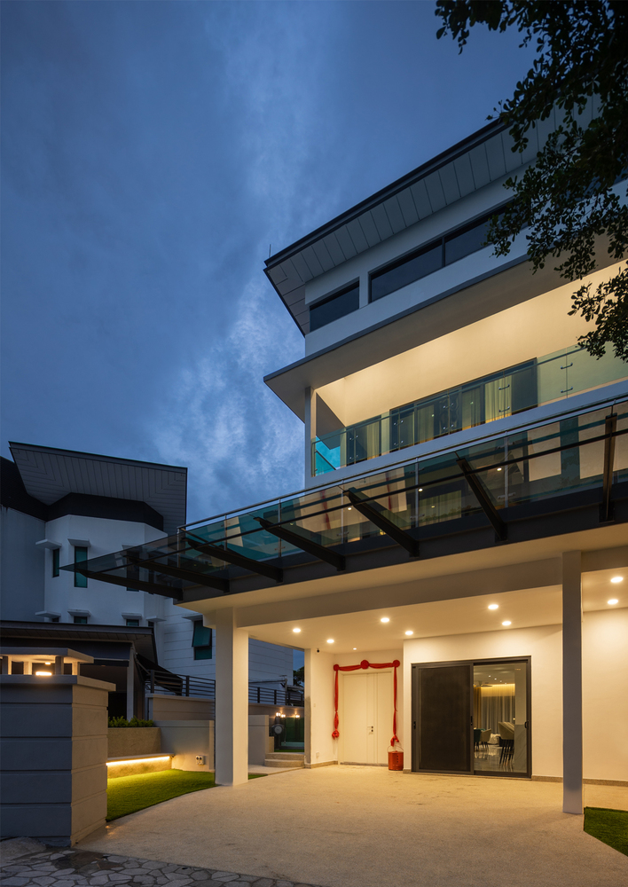 Modern house exterior with glass awning roof