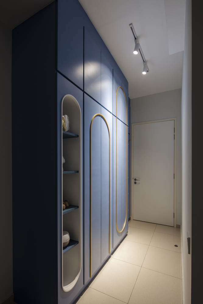 Modern wardrobe with blue and gold color cupboard